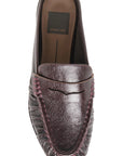 A single Dolce Vita leather loafer slip-on shoe in a dark brownish-purple hue, featuring textured leather, decorative stitching, and a pointed toe, shown from a top-down perspective on a white background.