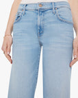 Light blue jeans worn by a person on a white background