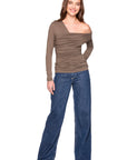 Woman wearing a brown off-shoulder top and blue jeans on a white background, full body front