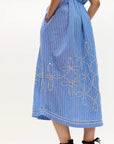 Blue striped dress with floral embroidery on a white background