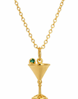 A gold chain necklace featuring a martini glass pendant with a small green gemstone garnish, shown against a plain white background.