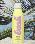 Bask SPF 50 Non-Aerosol Spray Sunscreen on the beach