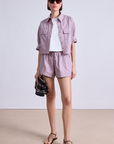 Apiece Apart Cropped Utility Shirt worn open, sleeve rolled up