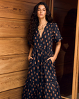 Xirena Goldin Midi Dress hands in pockets