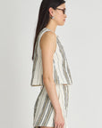 Woman wearing a striped dress on a white background