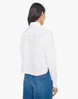 Person wearing a white shirt and blue jeans on a white background