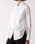 White blouse worn by a person on a white background