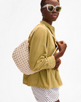 Clare V Lune Knot Woven Leather Bag on shoulder