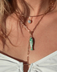 Thatch Fortuna Green Dot Charm on model close up