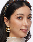Lele Sadoughi Piroutte Spiral Earring on model
