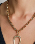 Adina Reyter 18" Chunky Rolo Chain on model with horseshoe charm