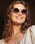 Krewe STL Nylon Caffe 24k Sunglasses on oval face, female model