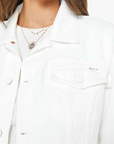 Woman wearing a white jacket on a plain background