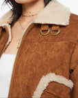 Brown suede jacket with shearling collar and white background