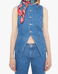 Woman wearing a denim vest and colorful scarf on a white background, front