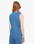 Woman wearing a blue denim vest and pants with a red and blue patterned scarf around her neck on a white background. back view
