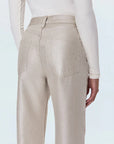Beige pants worn by a person on a white background