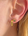 Olivia Green Cluster Stud Earrings on ear
