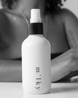 Riddle 4oz Milky Spray Lotion Original on table