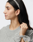 Lele Sadoughi Penny Seersucker Bow Scrunchie on wrist