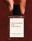 Perfume Oil No.09 Vallee De Farney .5oz held by fingers