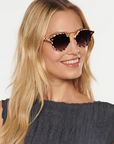 Krewe STL Nylon Caffe 24k Sunglasses on oval face, female model