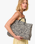 Clare V Summer Simple Tote Black/Cream Raffia held under arm