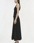 Woman wearing a black dress on a white background