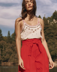 The Great the Beaded Slim Tank with red shorts