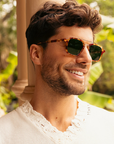Krewe Colton Hawksbill 12k Polarized on square face, male model