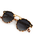 Krewe STL Nylon Caffe 24k Sunglasses folded, by itself