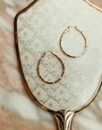 Sierra Winter Muse Hoop Earring on mirror