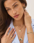 Large Sari Dagger Charm front view on model worn as earring