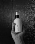 Riddle 4oz Milky Spray Lotion Santal in shower