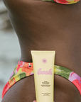 SPF 50 Lotion Sunscreen Travel Size next to model