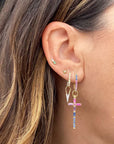 Single Classic Open Dagger Charm on model's ear paired with a few other earrings