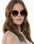Krewe STL Nylon Cherry 18k Sunglasses on square face, female model