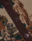 Close-up of a knit cardigan featuring a woodland camouflage pattern in brown, beige, and dark green, with a dark brown button placket and three dark brown buttons.
