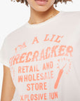 Person wearing a white t-shirt with pink text and graphics on a plain background, super close up view