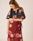 Natalie Martin Ella Top Poppy Print worn on shoulders