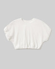 White crop top on a gray background