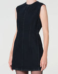 Black sleeveless dress worn by a model on a white background