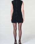 Black denim dress worn by a person on a white background