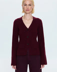 Woman wearing a burgundy cardigan on a white background