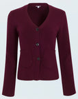 Woman wearing a burgundy cardigan on a white background