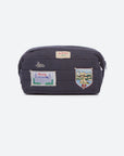 navy cosmetic bag with patches on white background
