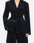 Woman wearing a dark blue suit on a white background
