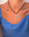 Amalfi Fish Clip Charm on model attached to silk chord necklace