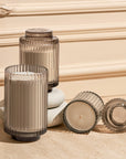 Set of Island Coconut 11oz Candles in glass holders on a textured surface