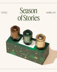 Three small bottles with different colored caps on a green box labeled 'Season of Stories' on a white background.